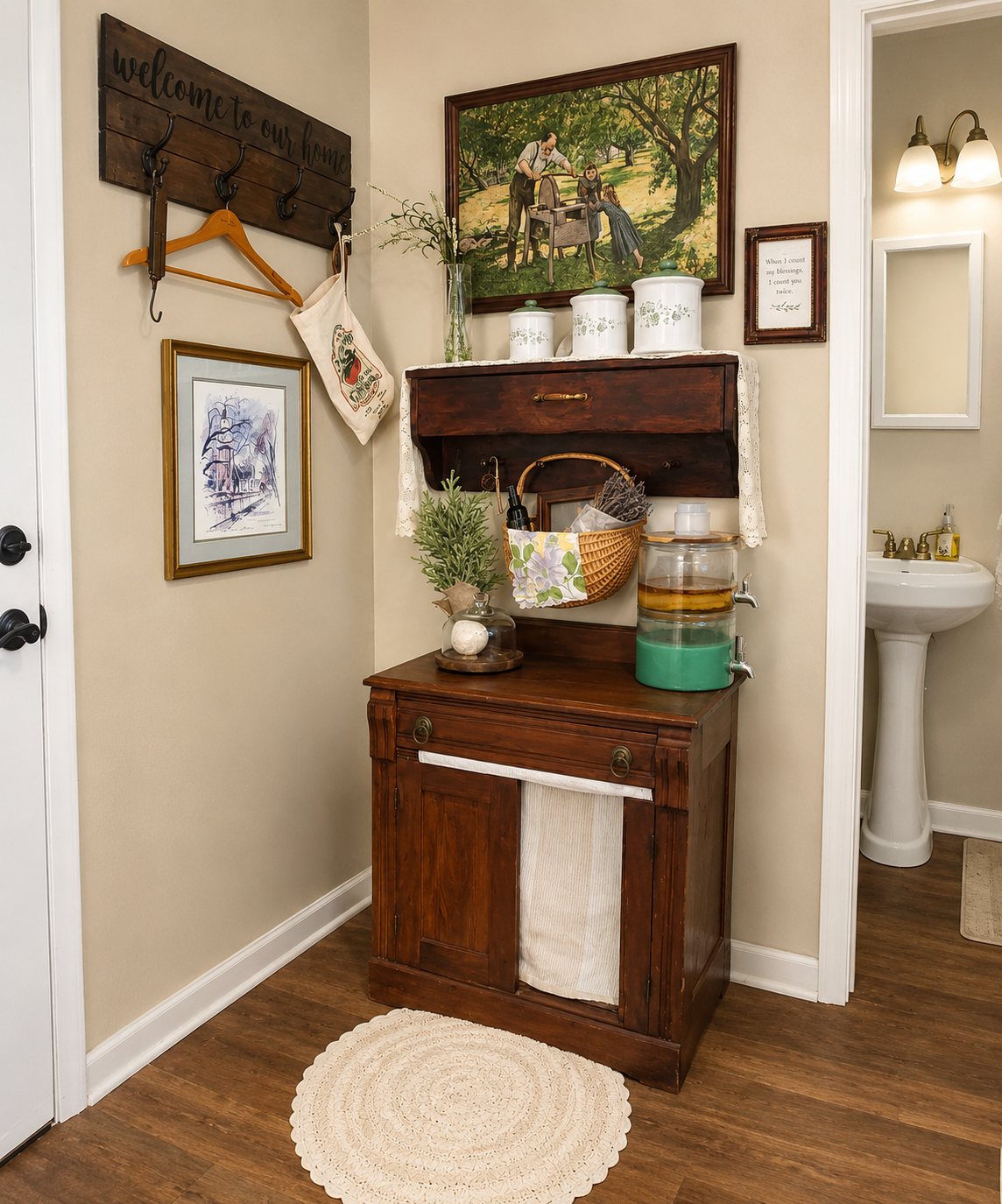 Rustic entryway corner with antique washstand, vintage painting, coat rack with welcome sign, and wicker basket